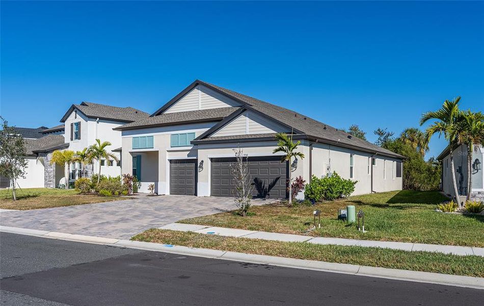 Front exterior of a new home in , Palmetto, FL, highlighting curb appeal (Image 27).