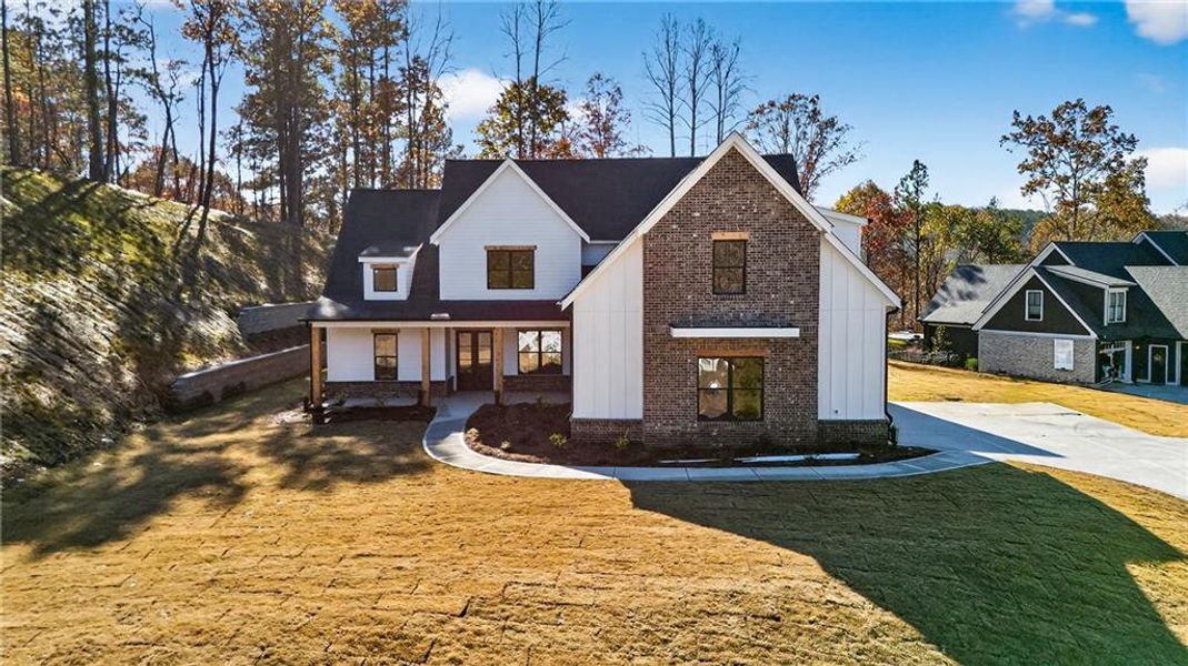 Front exterior of a new home in , Canton, GA, highlighting curb appeal (Image 15). Front exterior of a new home in , Canton, GA, highlighting curb appeal (Image 15).