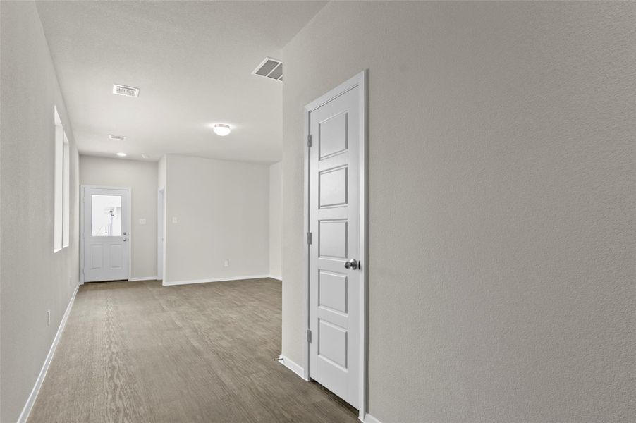 Corridor with baseboards and dark wood-type flooring