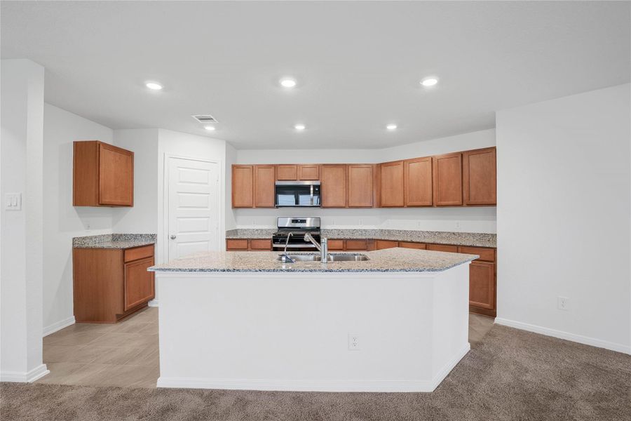 This spacious kitchen has it all—ample storage, generous counter space, and a layout that truly makes it the heart of the home. This spacious kitchen has it all—ample storage, generous counter space, and a layout that truly makes it the heart of the home.