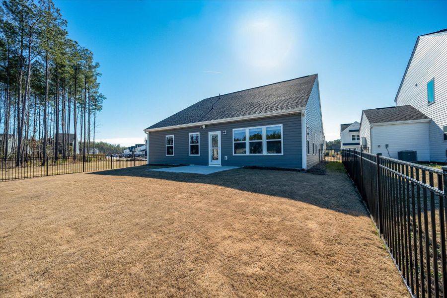 Exterior details and patio area of a home in , Ravenel (Image 23).