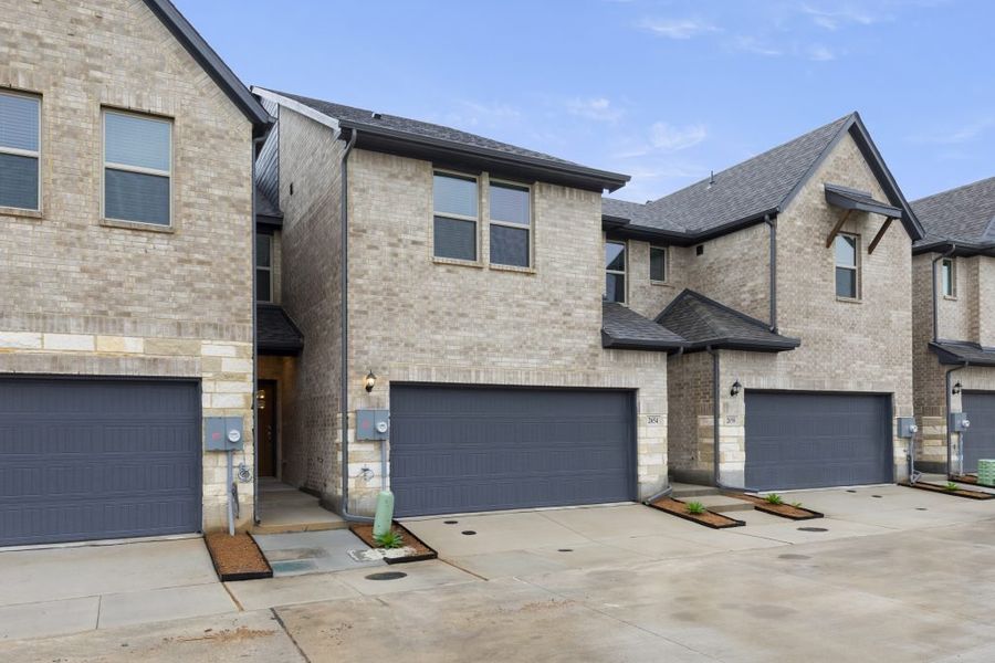 Front exterior of a new home in Sereno Oaks at Buckner Terrace, Dallas, TX, highlighting curb appeal (Image 2).