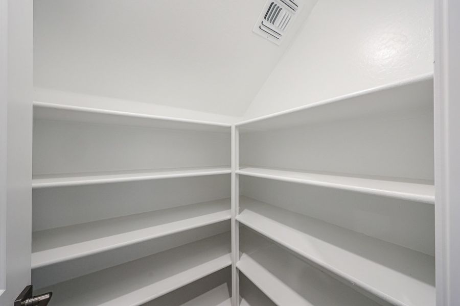 A white shelf with a light. A white shelf with a light.