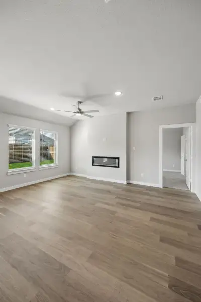 Living Room in the Emmy II home plan by Trophy Signature Homes - REPRESENTATIVE PHOTO