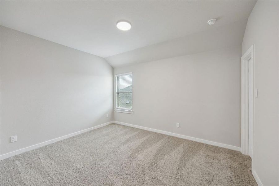 Bedroom in the Stanley II home plan by Trophy Signature Homes – REPRESENTATIVE PHOTO