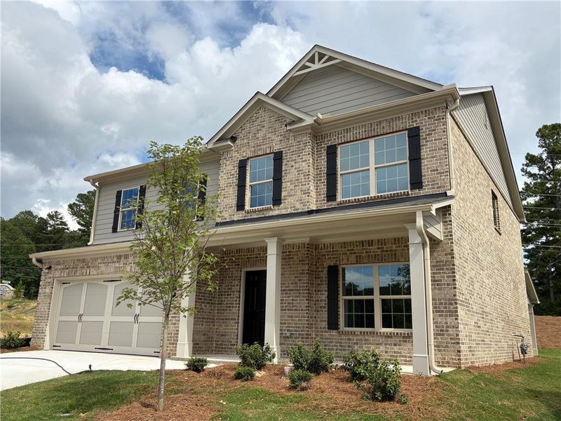 Front exterior of a new home in , Grayson, GA, highlighting curb appeal (Image 1).
