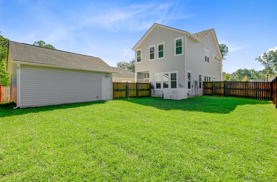 Exterior details and patio area of a home in Limehouse Village: Row Collection, Summerville (Image 25).