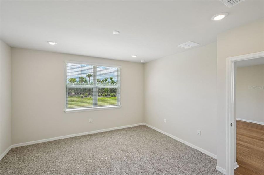 Spacious, unfurnished interior of a new home in Crescent Lakes - Premier Series, Punta Gorda (Image 24).