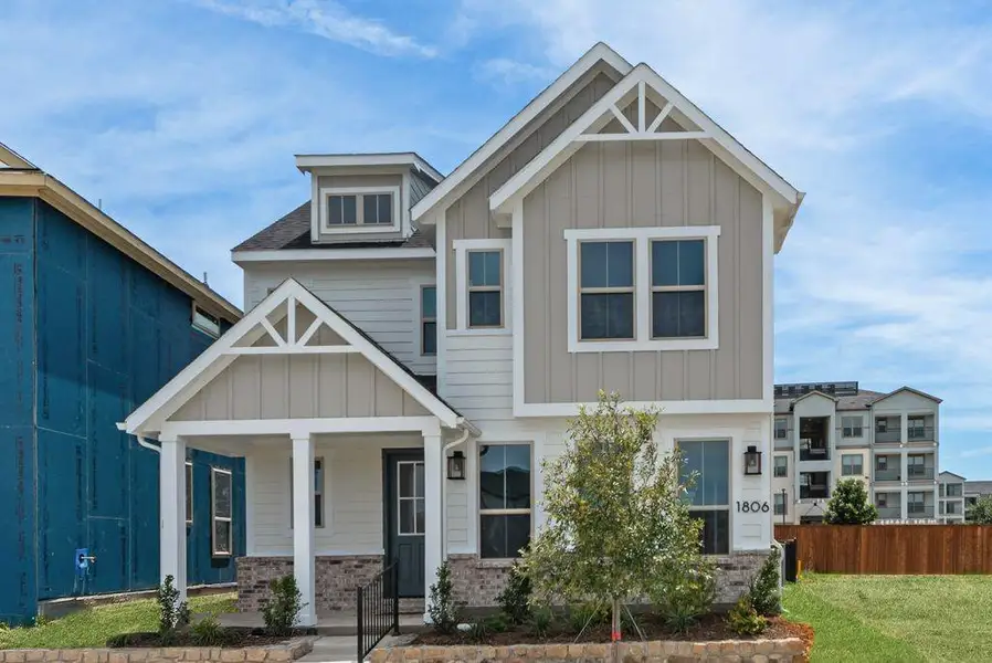 Front exterior of a new home in Bayside, Rowlett, TX, highlighting curb appeal (Image 20). Front exterior of a new home in Bayside, Rowlett, TX, highlighting curb appeal (Image 20).
