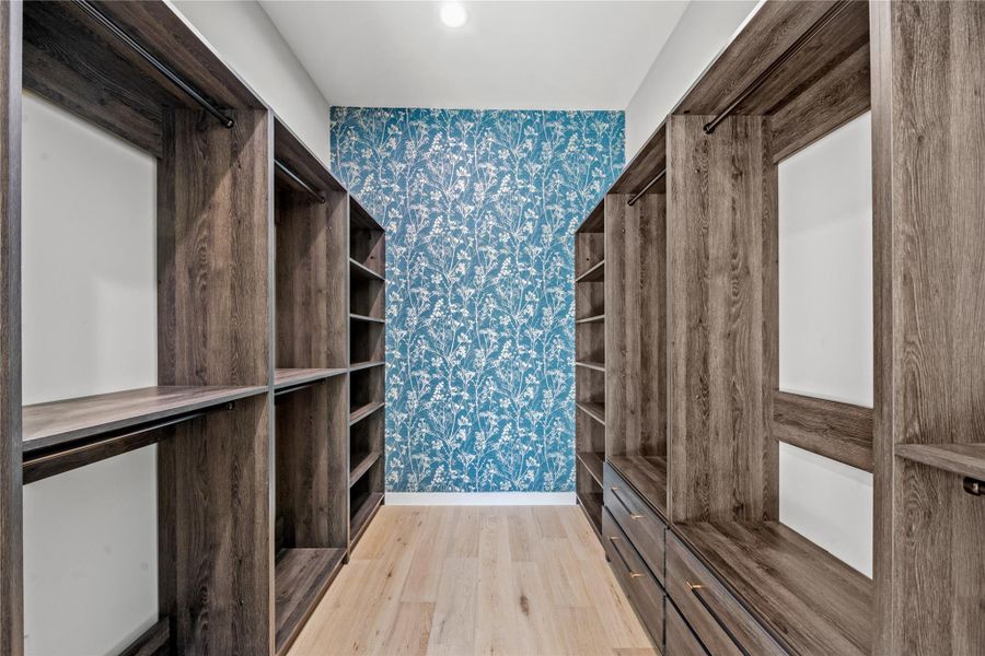 Walk in closet featuring light wood-style floors