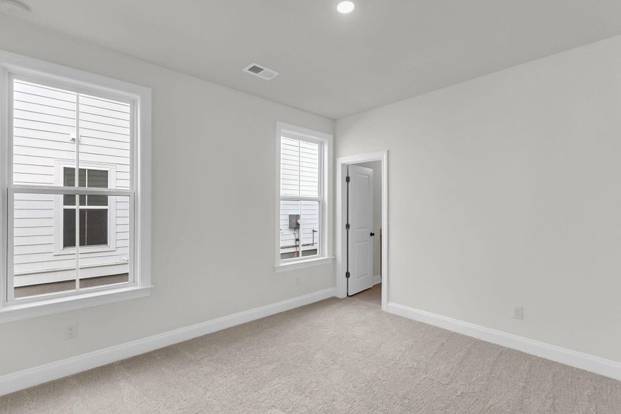 Spacious, unfurnished interior of a new home in Tidewater at Lakes of Cane Bay, Summerville (Image 42).
