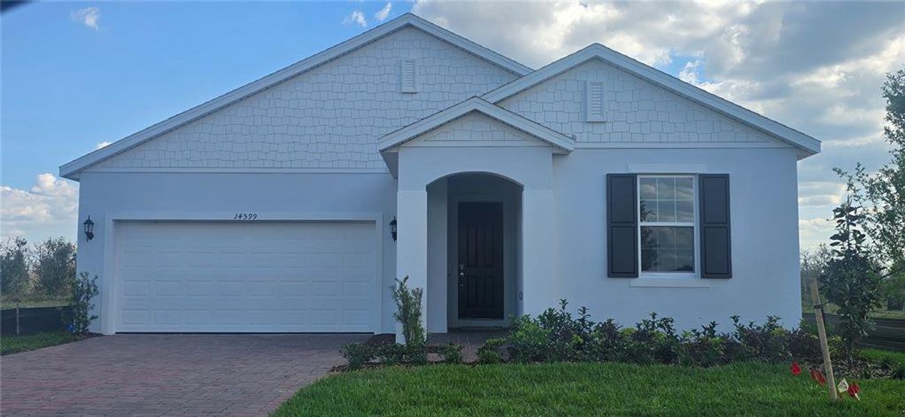 Front exterior of a new home in Ridgeview, Clermont, FL, highlighting curb appeal (Image 2).