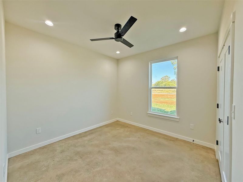 Guest bedroom featuring recessed lighting, ceiling fan, and a closet