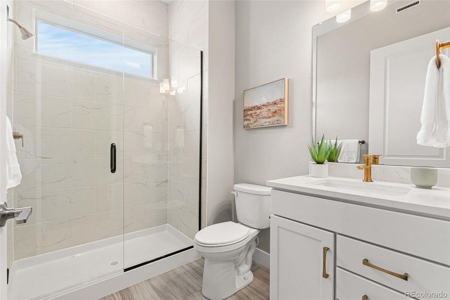 Furnished interior view inside a new home in Hilltop at Inspiration, Aurora (Image 29).