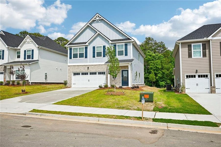Front exterior of a new home in Neely Farm, Covington, GA, highlighting curb appeal (Image 17).