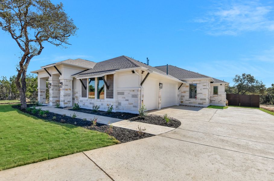 Representative exterior photo of a completed home built from the Sapphire by Giddens Homes in Riverstone, Georgetown, TX (Image 28).