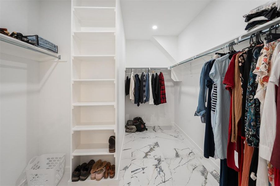 Large primary closet with built in shelves Large primary closet with built in shelves