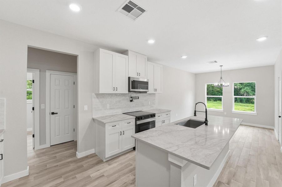 Furnished interior view inside a new home in , Conroe (Image 7).