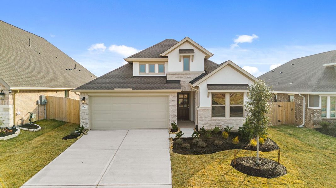 Front exterior of a new home in Escondido, Magnolia, TX, highlighting curb appeal (Image 22).