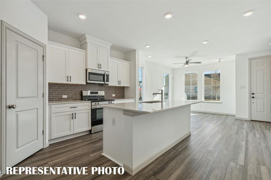 The chef will never be left out of the party in this great open concept floor plan!  REPRESENTATIVE PHOTO