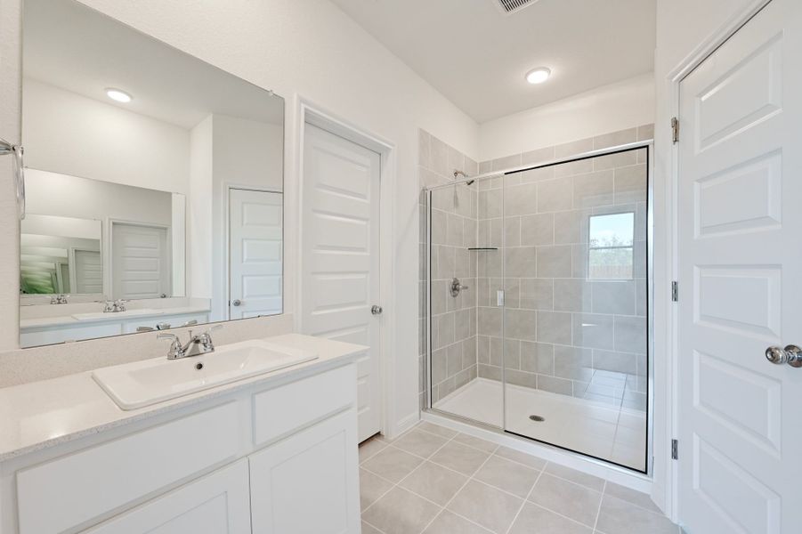 Primary Bath in the Cedar home plan by Trophy Signature Homes – REPRESENTATIVE PHOTO