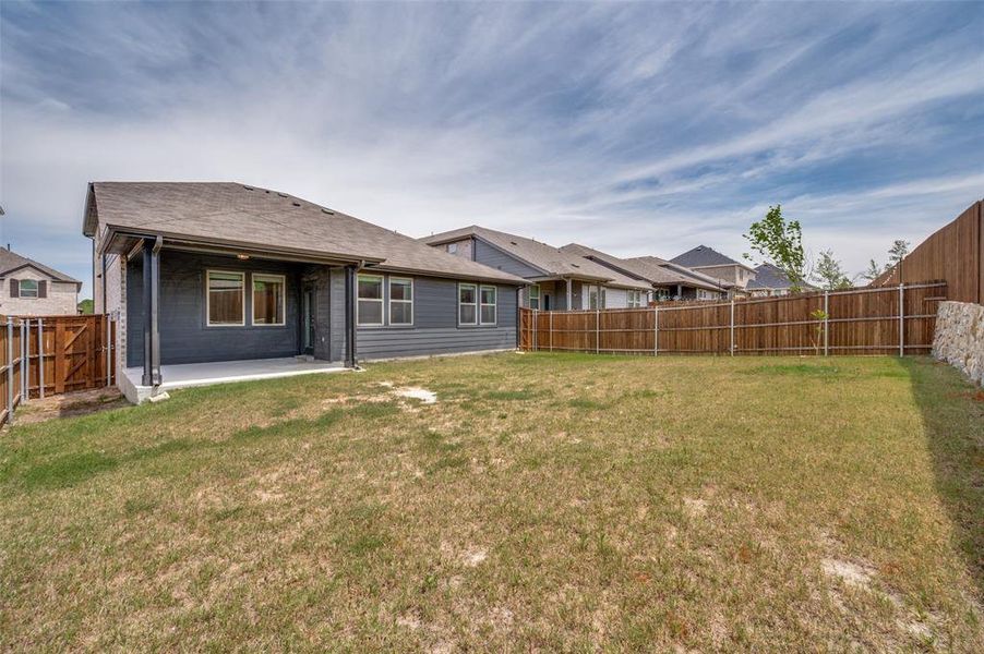 Exterior details and patio area of a home in The Villages of Hurricane Creek, Anna (Image 22).