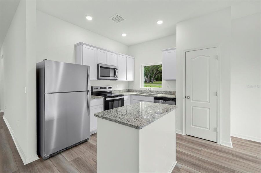 Furnished interior view inside a new home in Tula Parc, Astatula (Image 5).