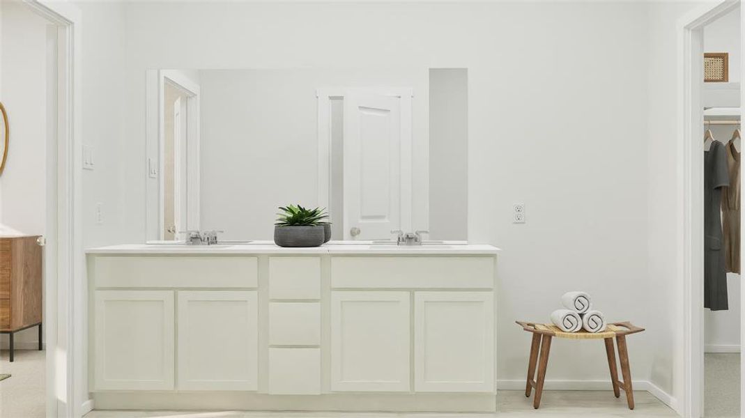 Bathroom with a spacious closet and double vanity