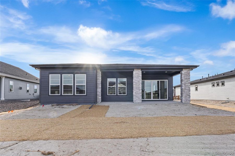 Exterior details and patio area of a home in Hilltop at Inspiration, Aurora (Image 3).