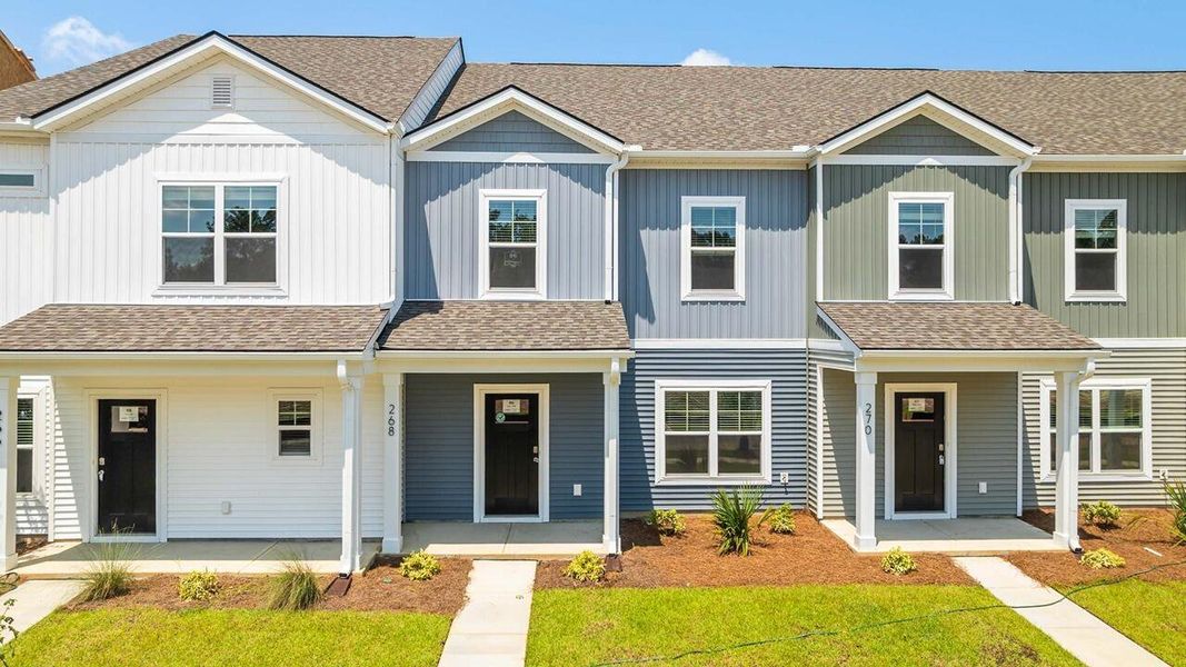 Front exterior of a new home in The Crossing at St. James, Summerville, SC, highlighting curb appeal (Image 2). Front exterior of a new home in The Crossing at St. James, Summerville, SC, highlighting curb appeal (Image 2).