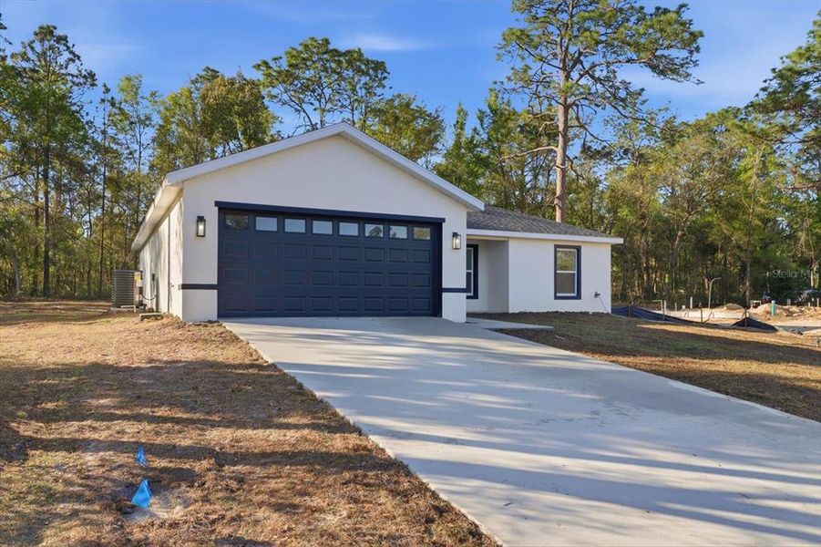 Front exterior of a new home in , Citrus Springs, FL, highlighting curb appeal (Image 22).