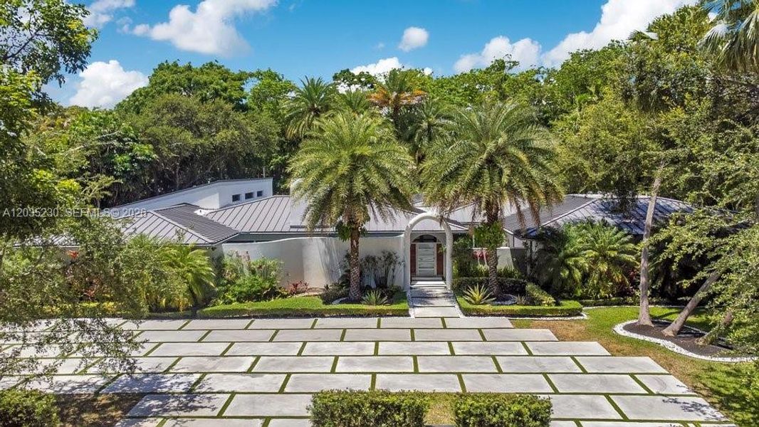 Front exterior of a new home in , Pinecrest, FL, highlighting curb appeal (Image 2). Front exterior of a new home in , Pinecrest, FL, highlighting curb appeal (Image 2).