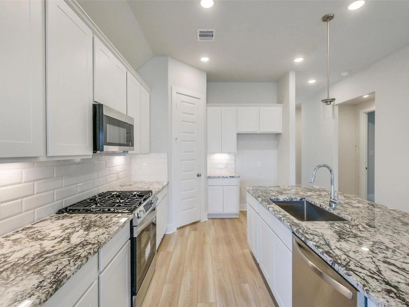 Furnished interior view inside a new home in Sunterra, Katy (Image 10).