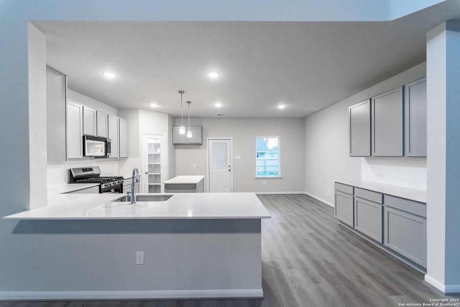 Furnished interior view inside a new home in Hennersby Hollow, San Antonio (Image 6).