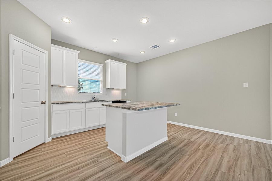 Furnished interior view inside a new home in Sunterra, Katy (Image 12).