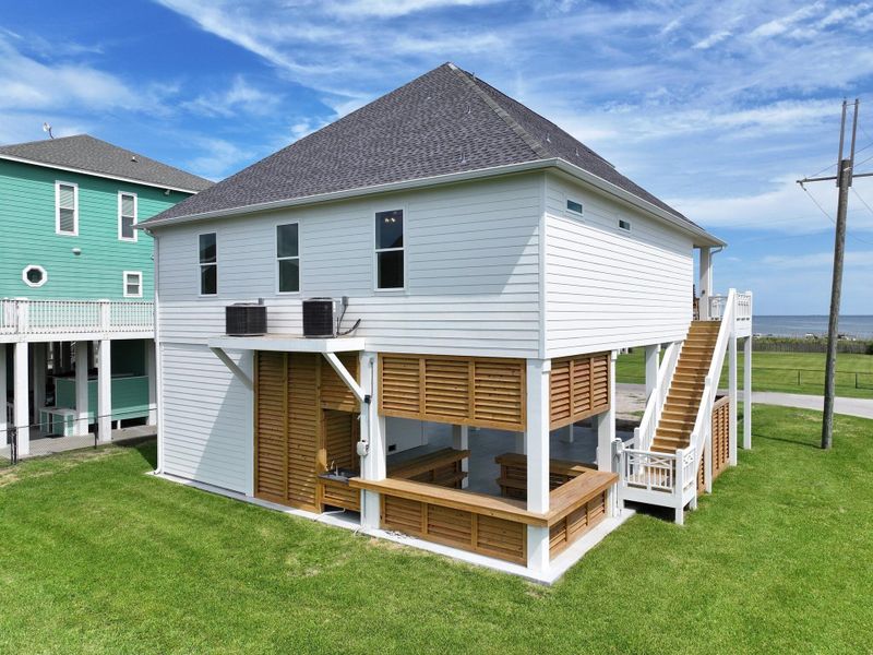 Front exterior of a new home in , Bolivar Peninsula, TX, highlighting curb appeal (Image 25). Front exterior of a new home in , Bolivar Peninsula, TX, highlighting curb appeal (Image 25).