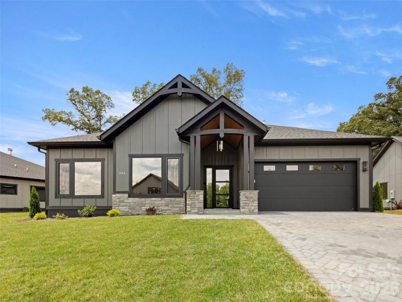 Front exterior of a new home in , Arden, NC, highlighting curb appeal (Image 1). Front exterior of a new home in , Arden, NC, highlighting curb appeal (Image 1).