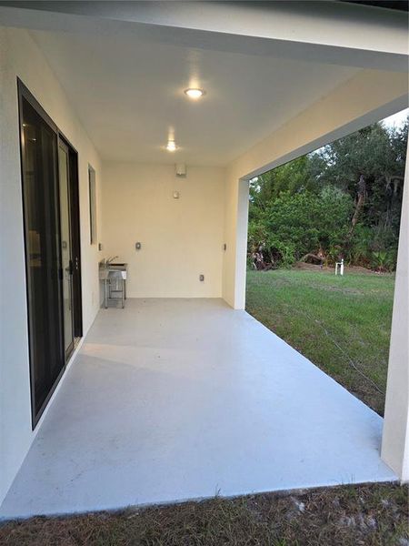 Exterior details and patio area of a home in , North Port (Image 29).