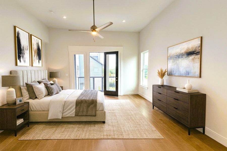 Primary Bedroom w/ Own Private Balcony.  Wide Plank Wood Flooring (Pic was virtually staged)