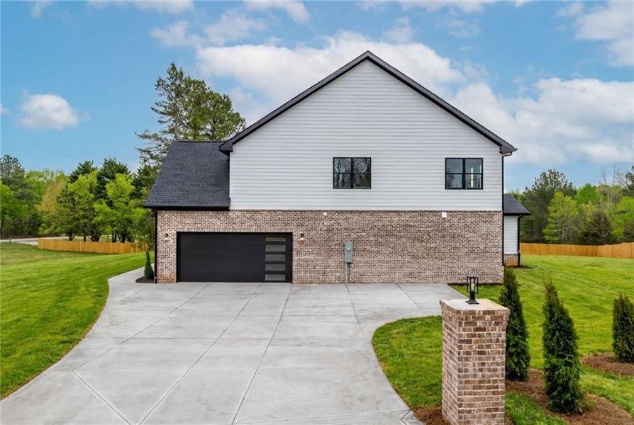 Front exterior of a new home in , Pendergrass, GA, highlighting curb appeal (Image 22).