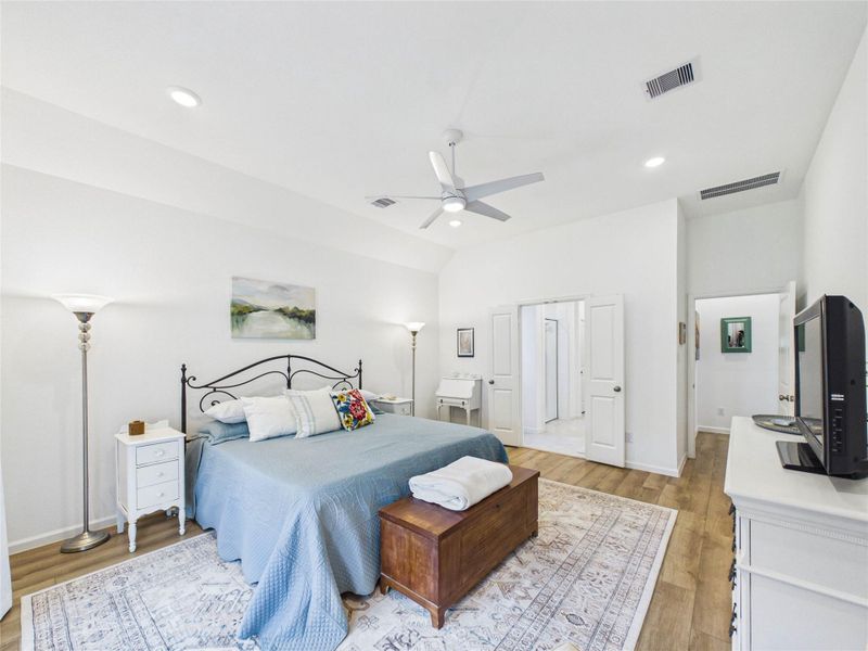 Tucked away off of the living room this private primary retreat is all about space and relaxation. Through the double doors is your en-suite bathroom.