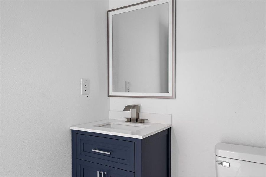 Bathroom with vanity and toilet