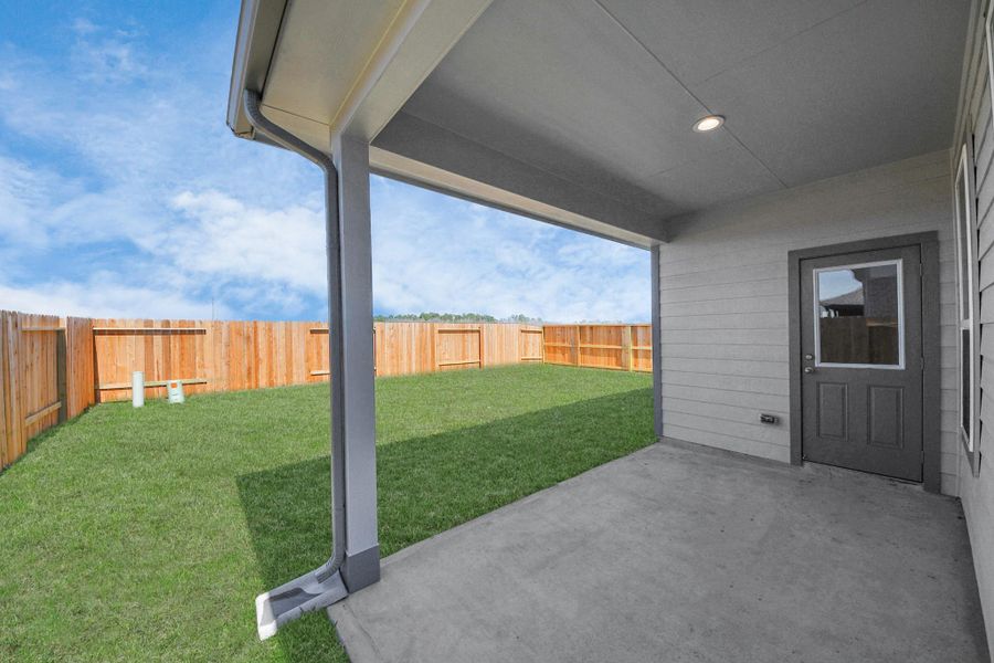 Experience outdoor living at its finest on this expansive covered patio, thoughtfully designed for BBQs and delightful outdoor dining. Sample photo of completed home with similar floor plan. Actual colors and selections may vary. Experience outdoor living at its finest on this expansive covered patio, thoughtfully designed for BBQs and delightful outdoor dining. Sample photo of completed home with similar floor plan. Actual colors and selections may vary.