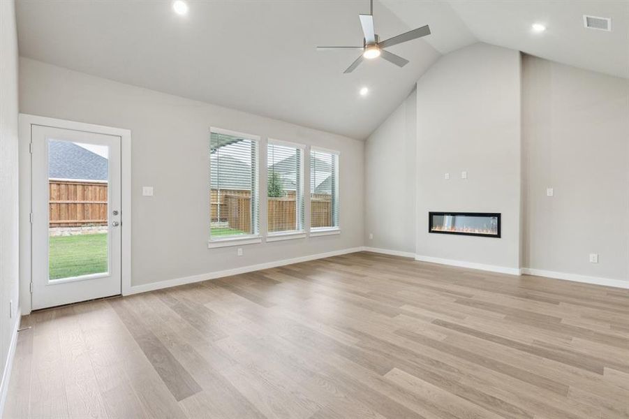 Living and Dining Room in the Stanley II home plan by Trophy Signature Homes – REPRESENTATIVE PHO