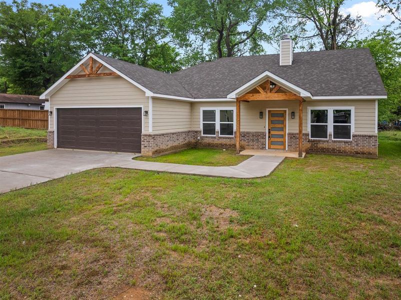 Front exterior of a new home in , Pittsburg, TX, highlighting curb appeal (Image 18). Front exterior of a new home in , Pittsburg, TX, highlighting curb appeal (Image 18).