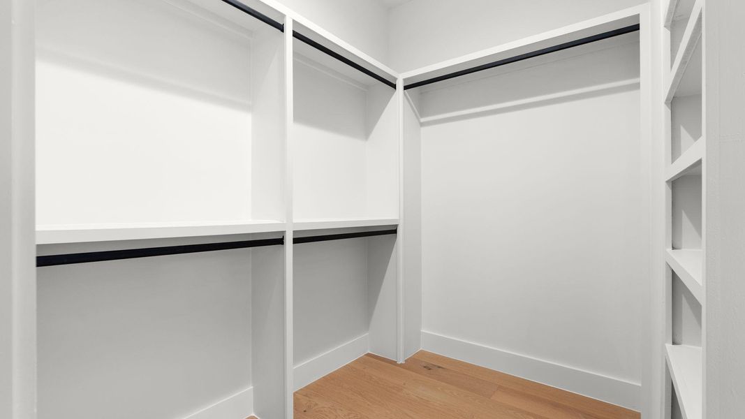 Walk in closet featuring light wood finished floors