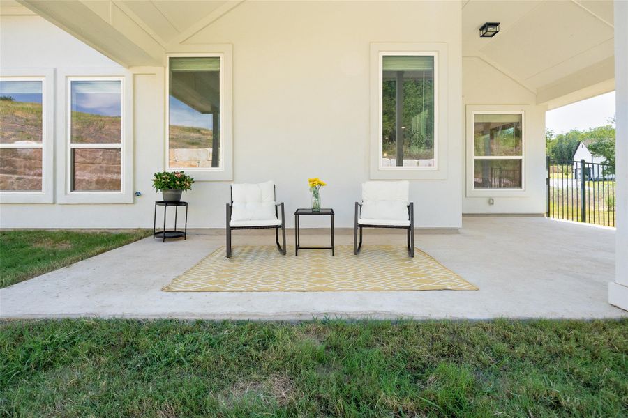 Step outside to a covered patio—perfect for outdoor entertaining or simply unwinding as you take in the beautiful Hill Country sunsets.