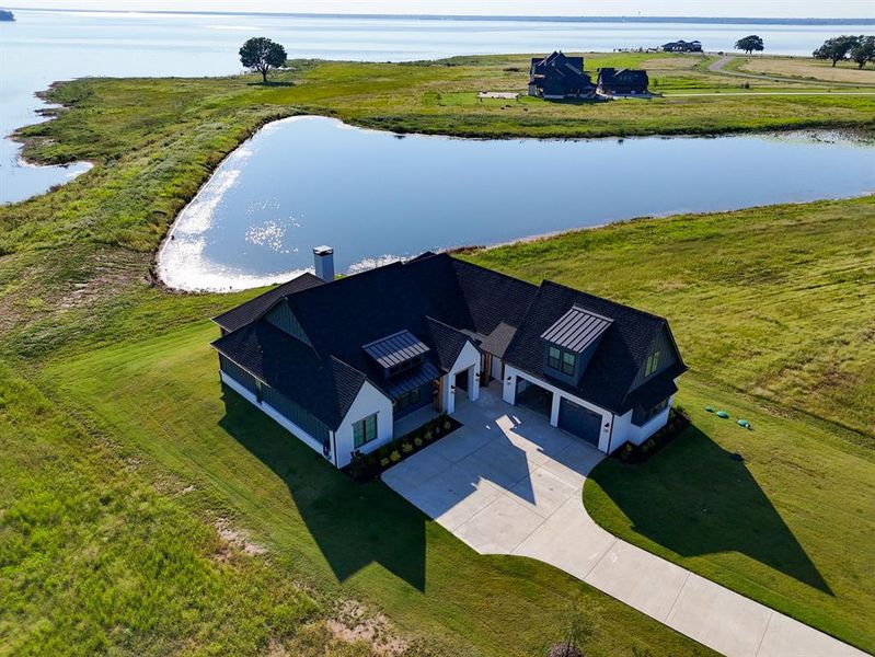 View of subject property featuring a nearby body of water View of subject property featuring a nearby body of water