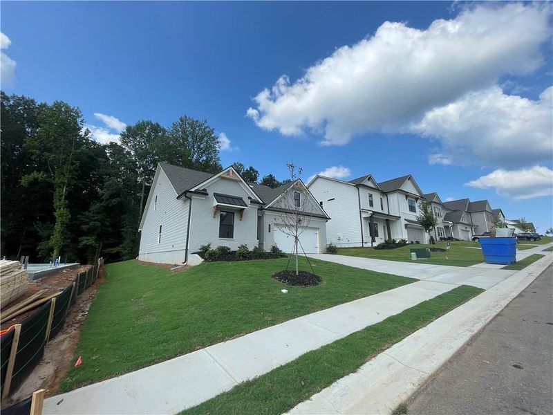 Front exterior of a new home in Summerlin, Winder, GA, highlighting curb appeal (Image 21).