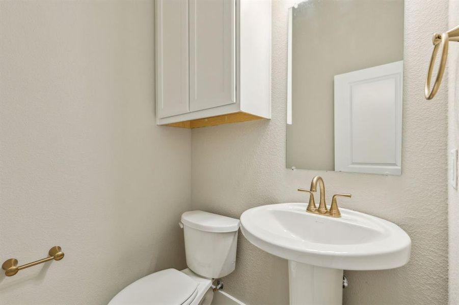 Bathroom featuring toilet and sink